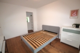 Schlafzimmer mit Ankleide - Teilmöbilierte moderne Einliegerwohnung mit Terrasse – Erstbezug!